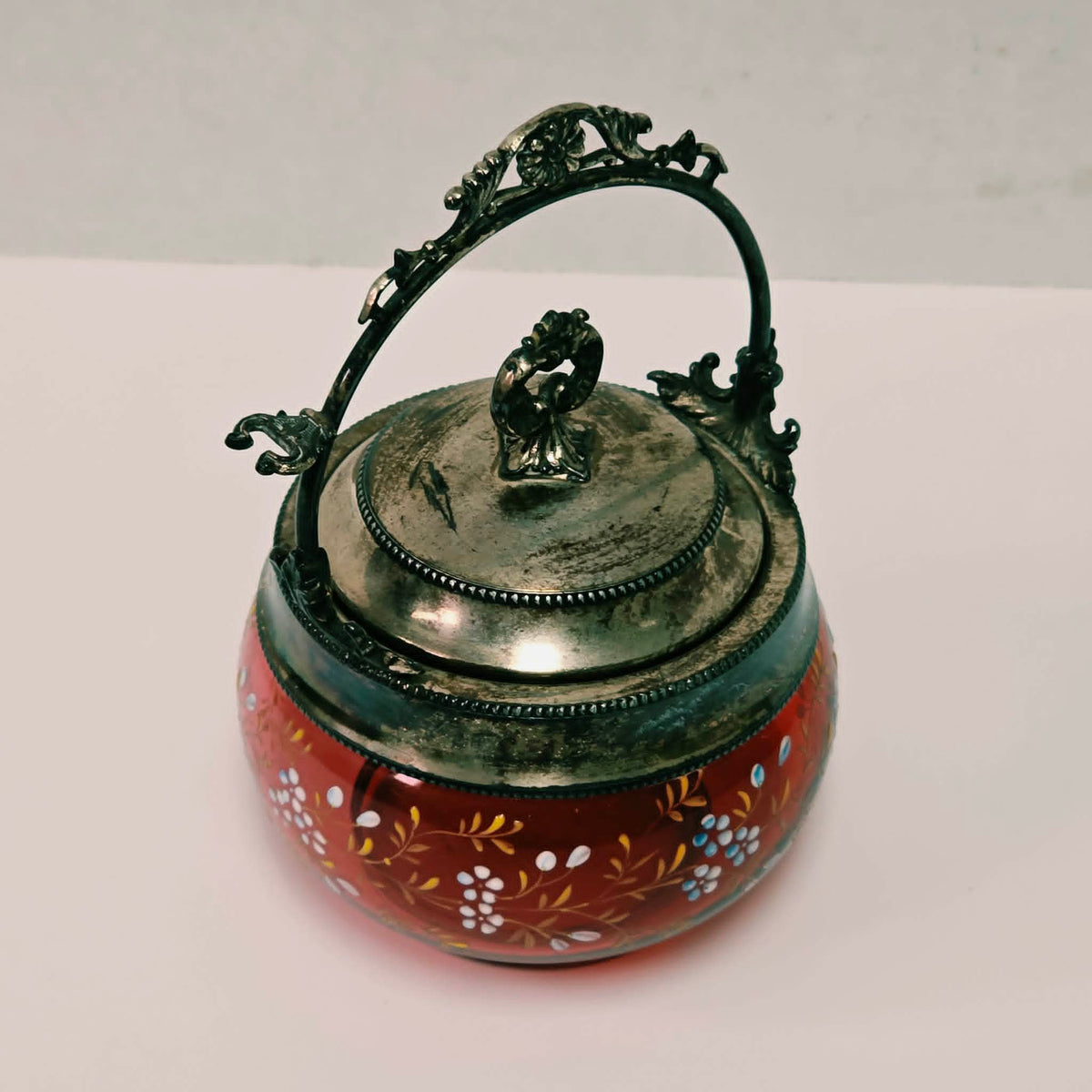 Victorian cranberry glass pickle caster sugar bowl with hand-painted floral decoration and silver holder
