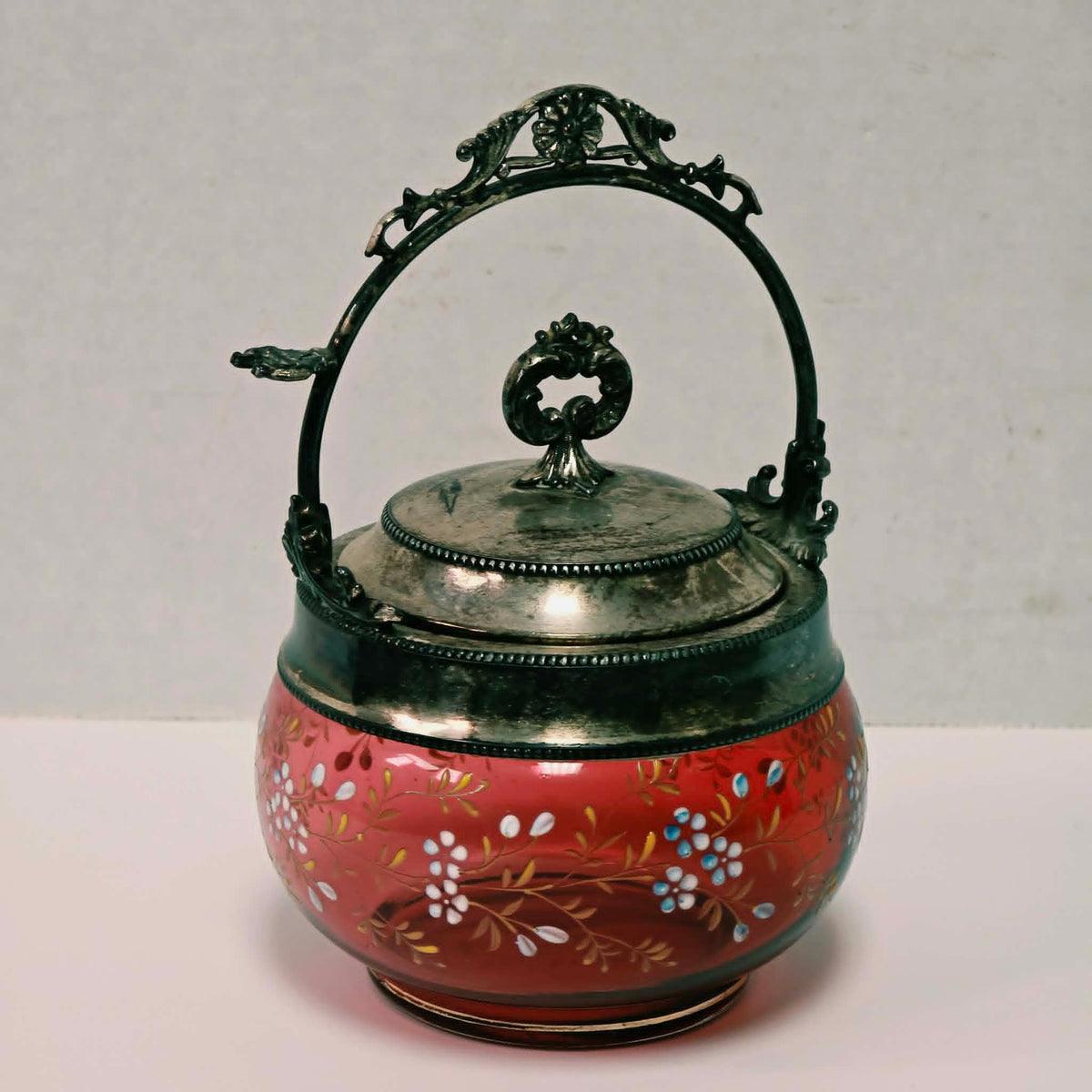 Victorian cranberry glass pickle caster sugar bowl with hand-painted floral decoration and silver holder
