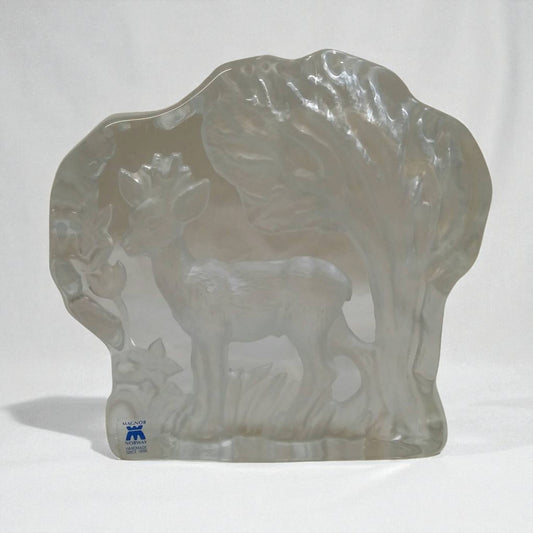 Clear glass sculpture of a deer with a white background
