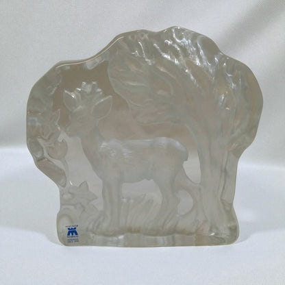 Clear glass sculpture of a buffalo on a white background