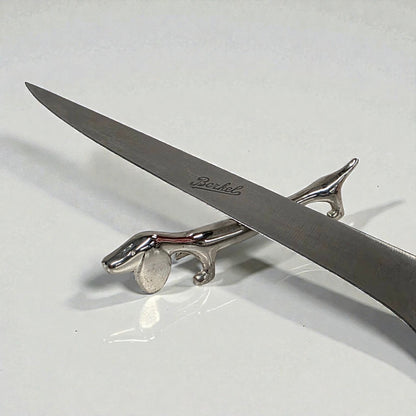 Silver dachshund  knife holder  with 'Bentley' branding on a white background