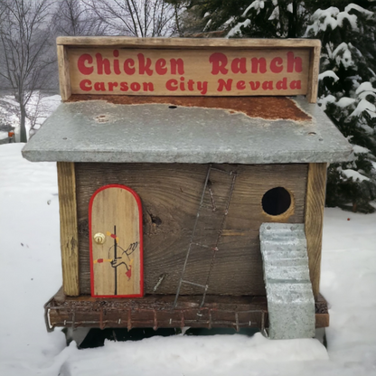 Handmade rustic Chicken Ranch folk art birdhouse made from reclaimed materials with chicken-themed artwork.
