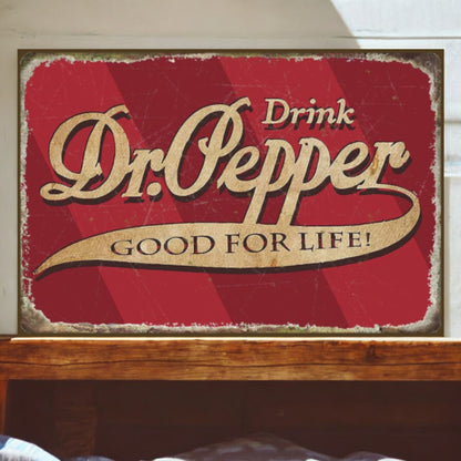 Vintage-style Dr. Pepper sign on a wooden surface with a white wall background