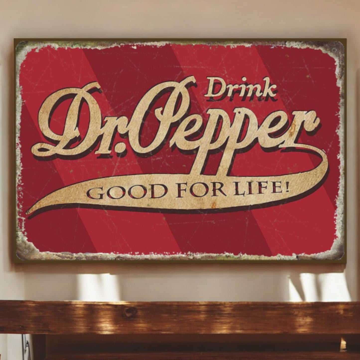 Vintage-style Dr. Pepper sign with red background and gold text on a wooden surface.