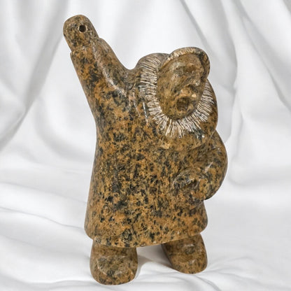 Brown stone sculpture of a figure with raised arm on a white background