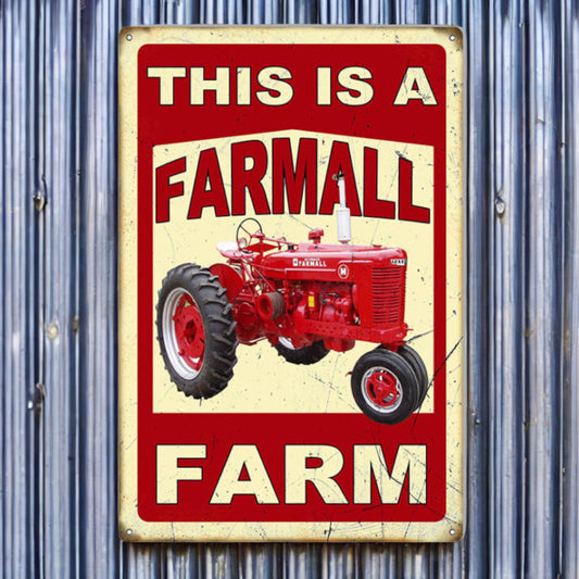 Vintage-style sign with a red Farmall tractor on a corrugated metal background
