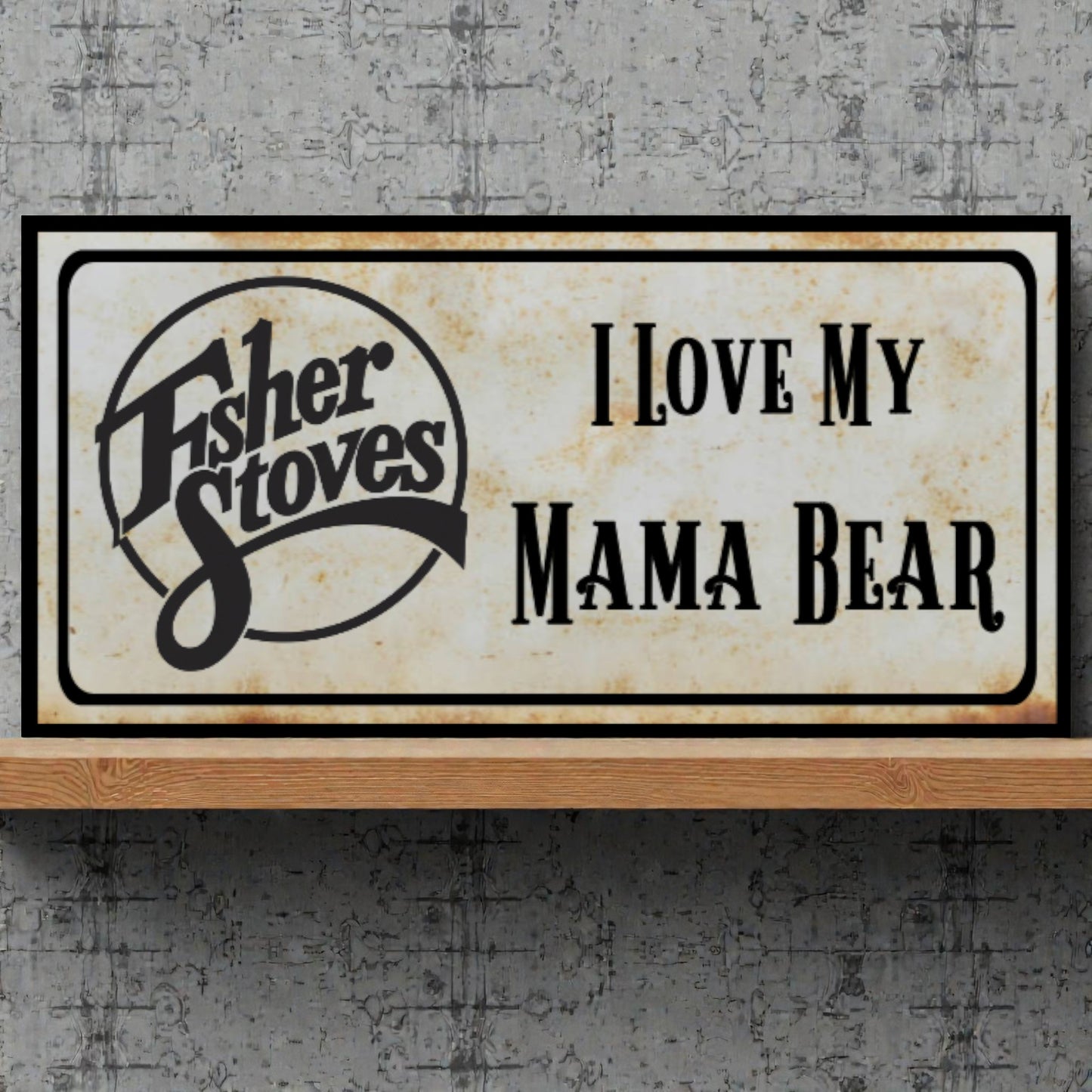 Fisher Stoves sign with 'I Love My Mama Bear' text on a textured wall background