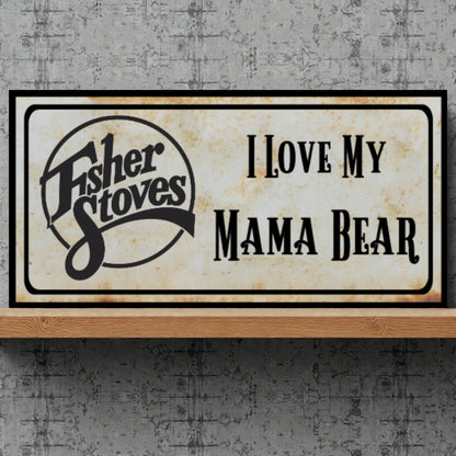 Fisher Stoves sign with 'I Love My Mama Bear' text on a textured wall background