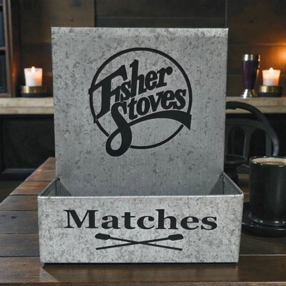 Matches box with Fisher Stoves logo on a wooden surface