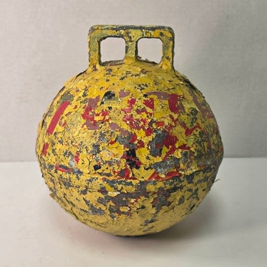 Antique yellow Newfoundland fishing buoy stamped Phillips Trawl Products Ltd., Grimsby England.