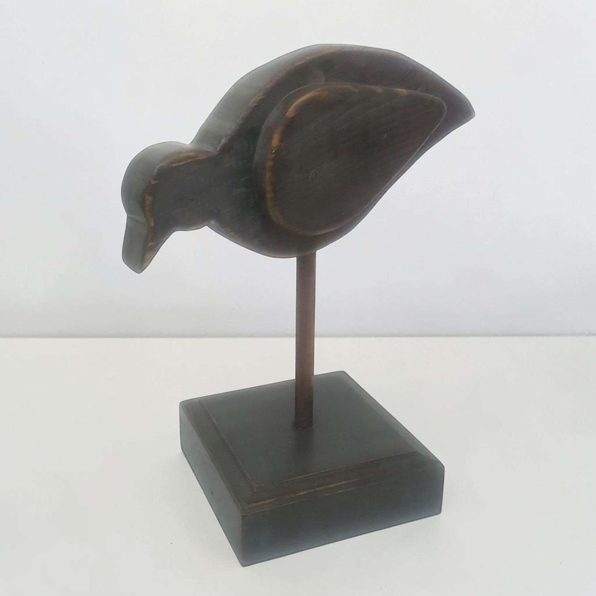 Large folk art bird sculpture with oak base and copper leg for primitive country farmhouse décor.