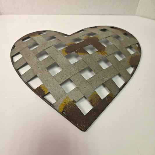 Rustic woven galvanized metal folk art heart wall hanging.