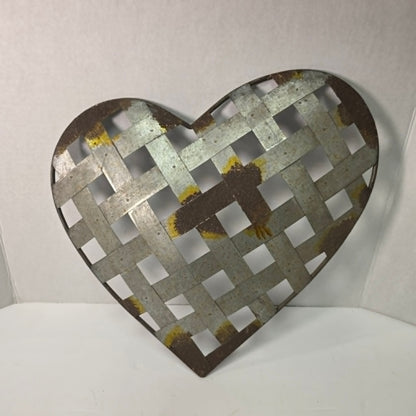 Rustic woven galvanized metal folk art heart wall hanging.