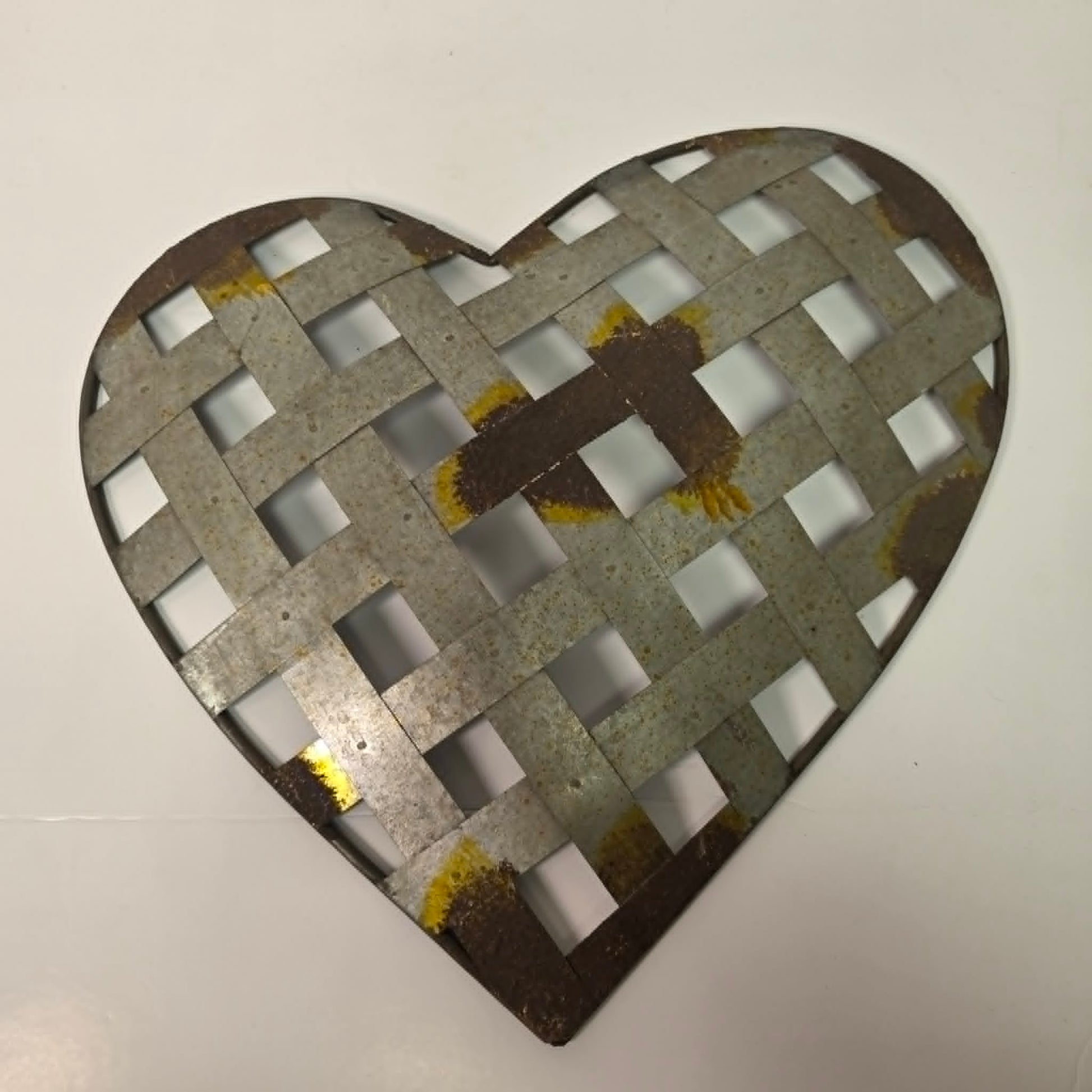 Rustic woven galvanized metal folk art heart wall hanging.