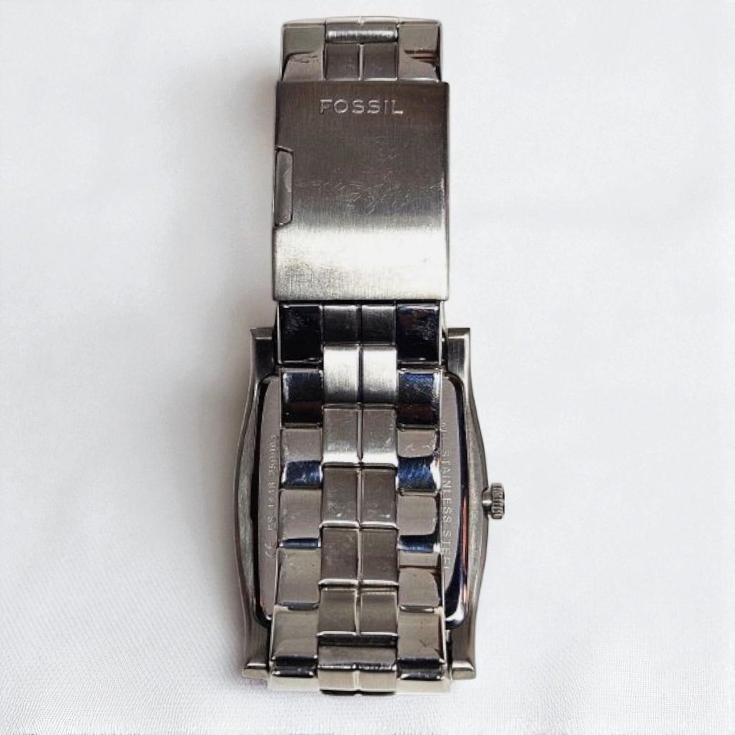 Silver Fossil watch on a white background