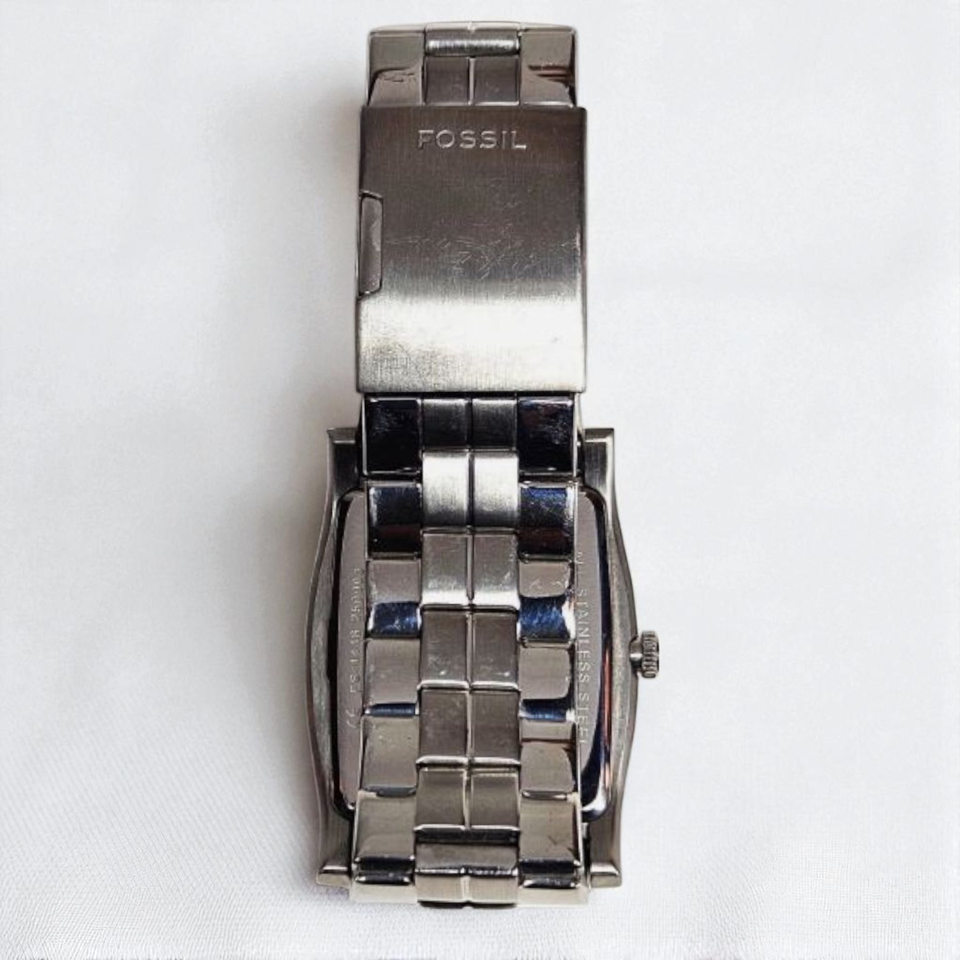 Silver Fossil watch on a white background