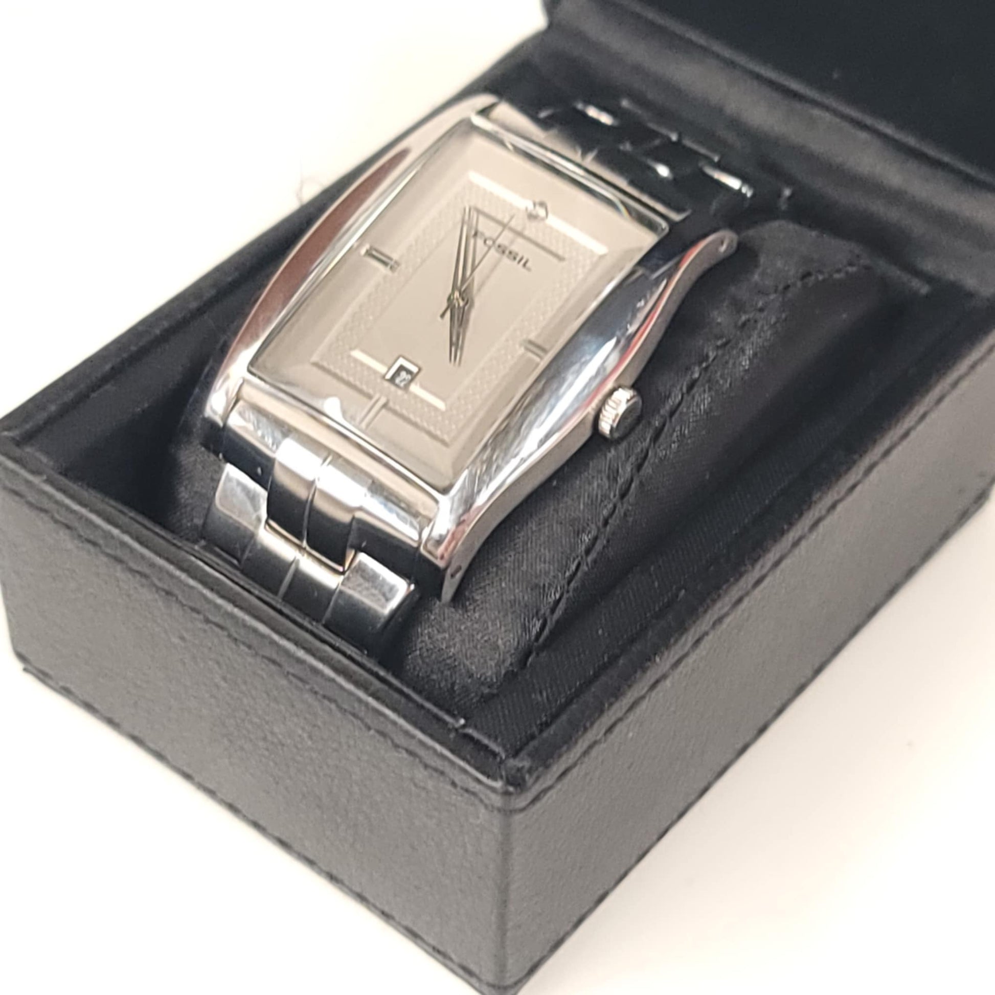 Silver watch in a black box on a white background