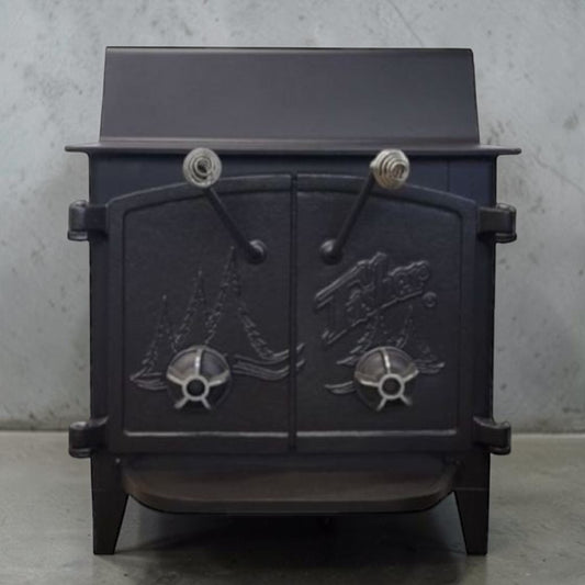 Fisher Grandma Bear wood stove with cathedral style doors and rear vent chimney cooking surface.
