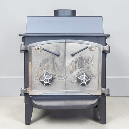 Vintage Fisher Grandma Bear wood stove with full nickel cathedral doors and top chimney vent.

