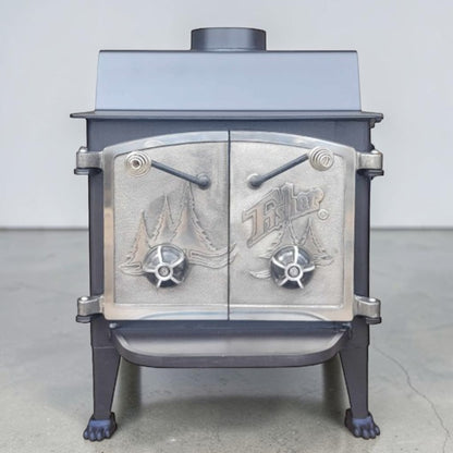 Vintage Fisher Grandma Bear wood stove with full nickel cathedral doors and top chimney vent.
