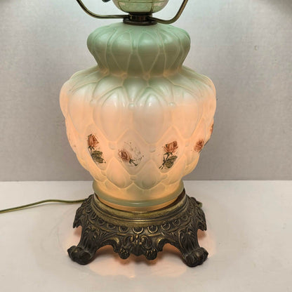 A beautiful vintage pastel green floral tri-light hurricane lamp offering classic elegance and a warm glow for any room.