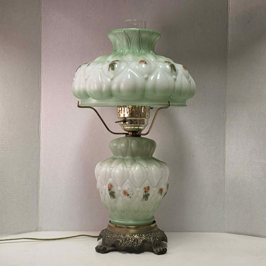 A beautiful vintage pastel green floral tri-light hurricane lamp offering classic elegance and a warm glow for any room.