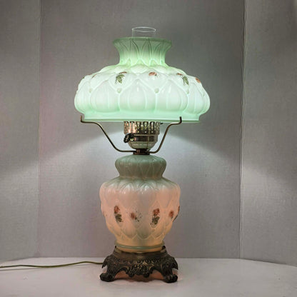 A beautiful vintage pastel green floral tri-light hurricane lamp offering classic elegance and a warm glow for any room.