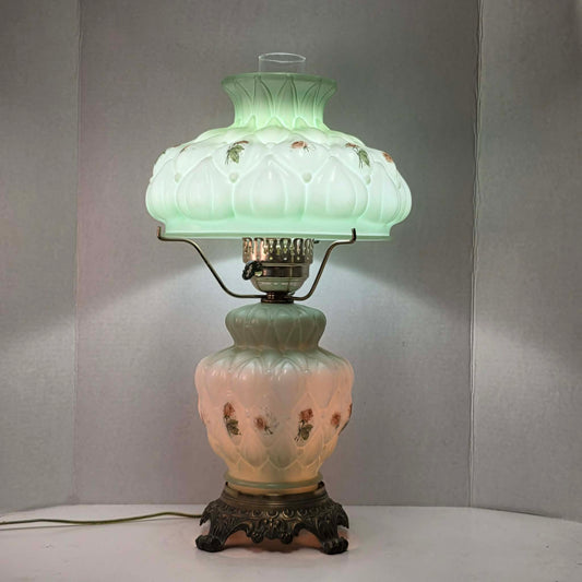 A beautiful vintage pastel green floral tri-light hurricane lamp offering classic elegance and a warm glow for any room.