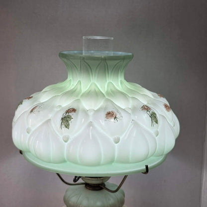 A beautiful vintage pastel green floral tri-light hurricane lamp offering classic elegance and a warm glow for any room.