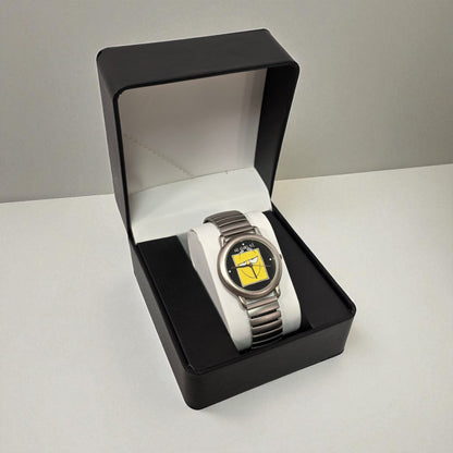 Silver watch with a white strap in a black box on a light gray background