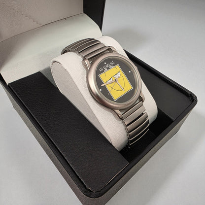 Watch with a yellow face in a black box on a gray background