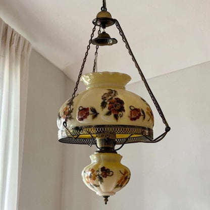 Large antique floral puffy hanging lamp with adjustable chain and 14-inch fitter.
