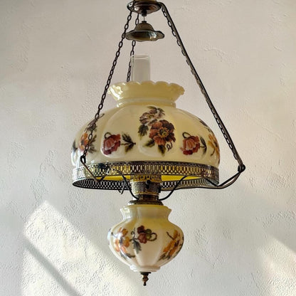 Large antique floral puffy hanging lamp with adjustable chain and 14-inch fitter.
