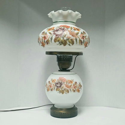 Vintage Gone With The Wind hurricane lamp with floral needlepoint design shade and base, tri-light lamp measuring 21 inches tall.