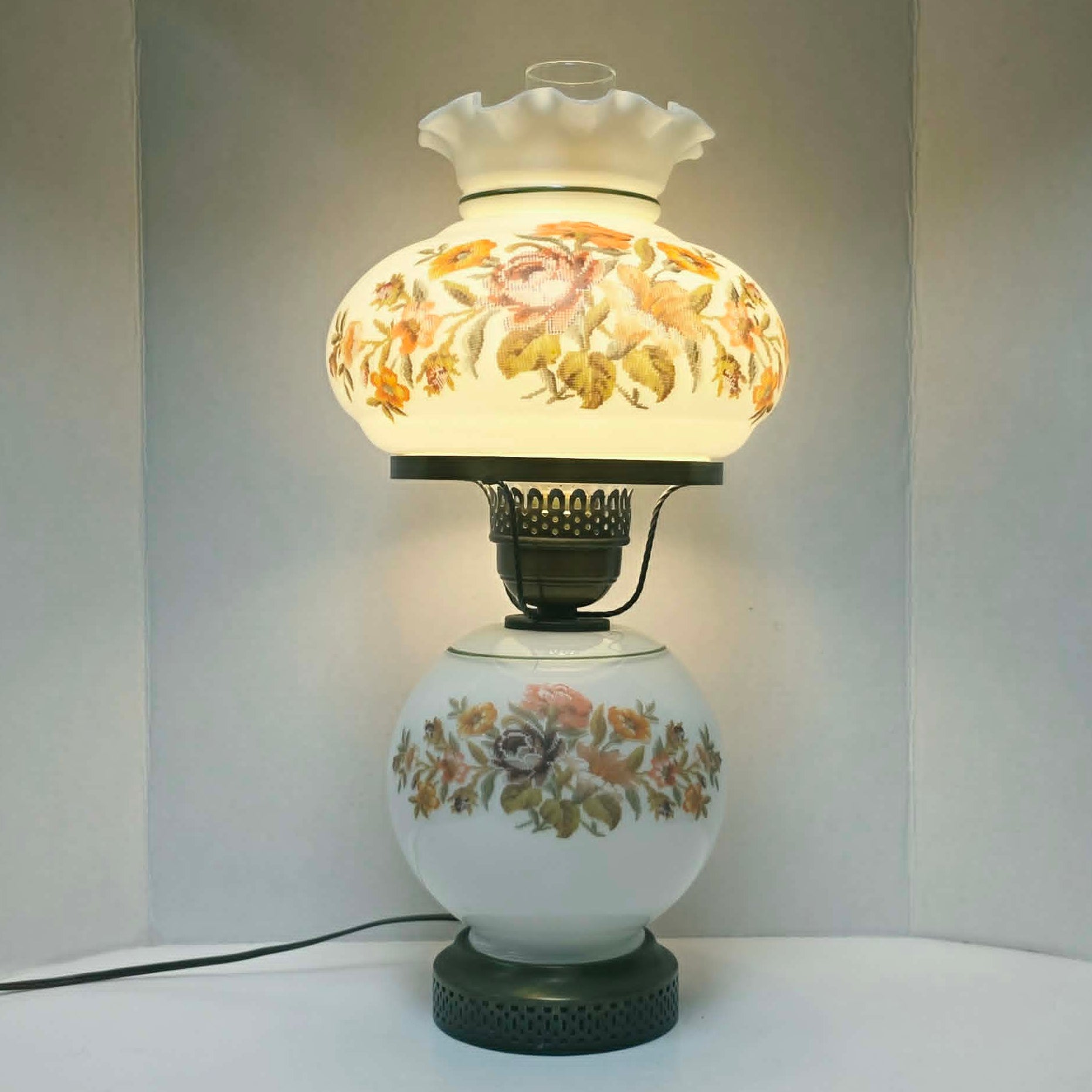Vintage Gone With The Wind hurricane lamp with floral needlepoint design shade and base, tri-light lamp measuring 21 inches tall.
