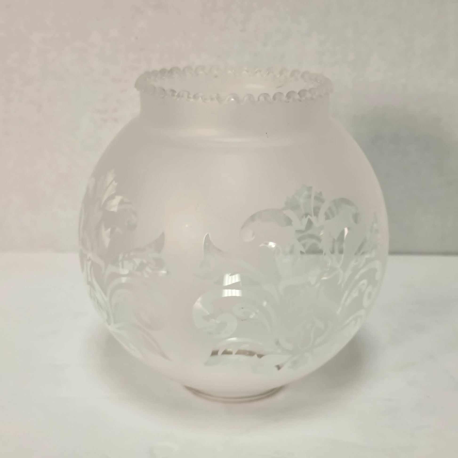 Vintage brass hurricane candle holder with elegant etched glass globe.