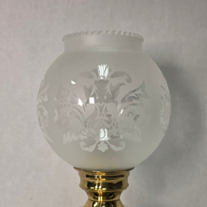 Vintage brass hurricane candle holder with elegant etched glass globe.