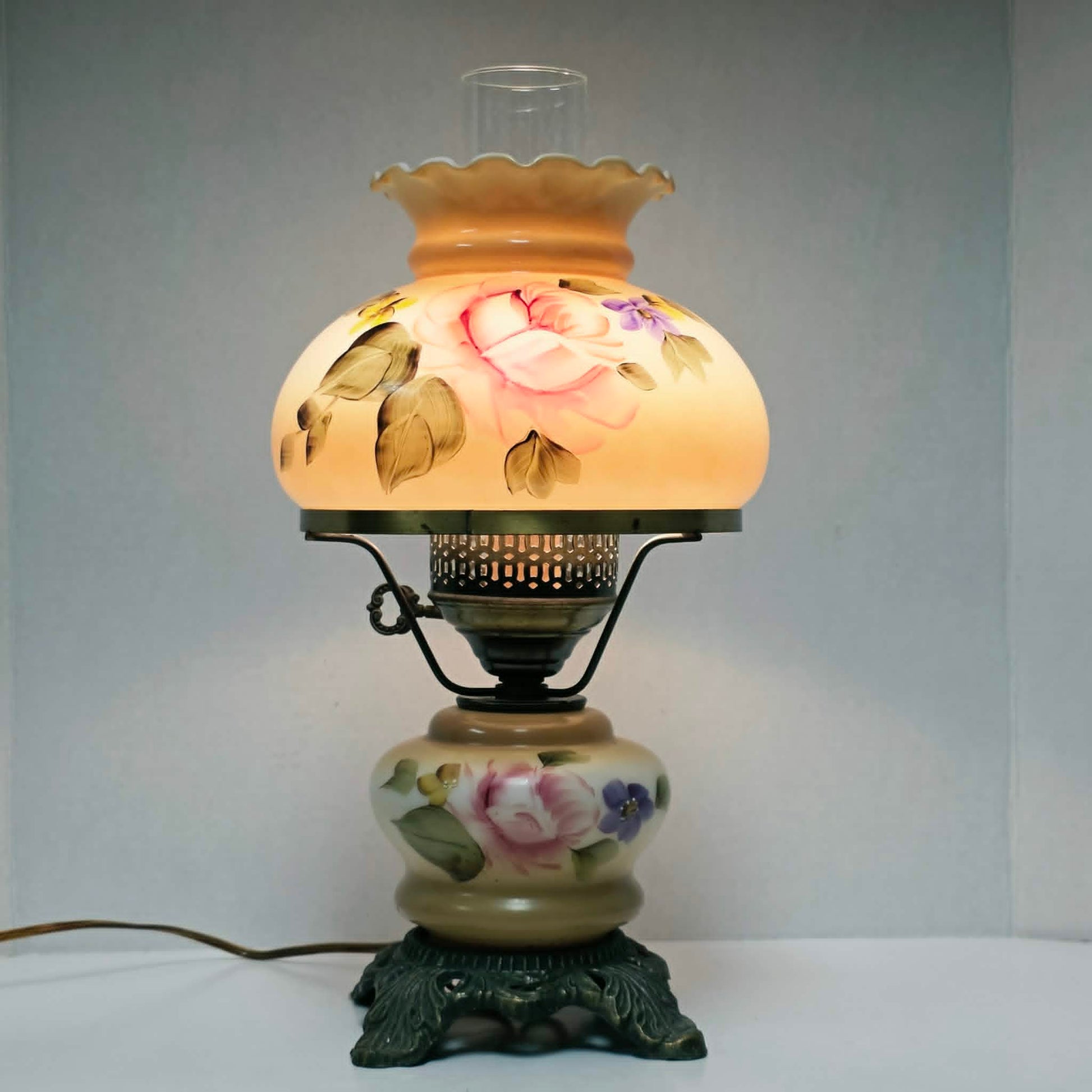 Elegant vintage hurricane lamp with floral glass design