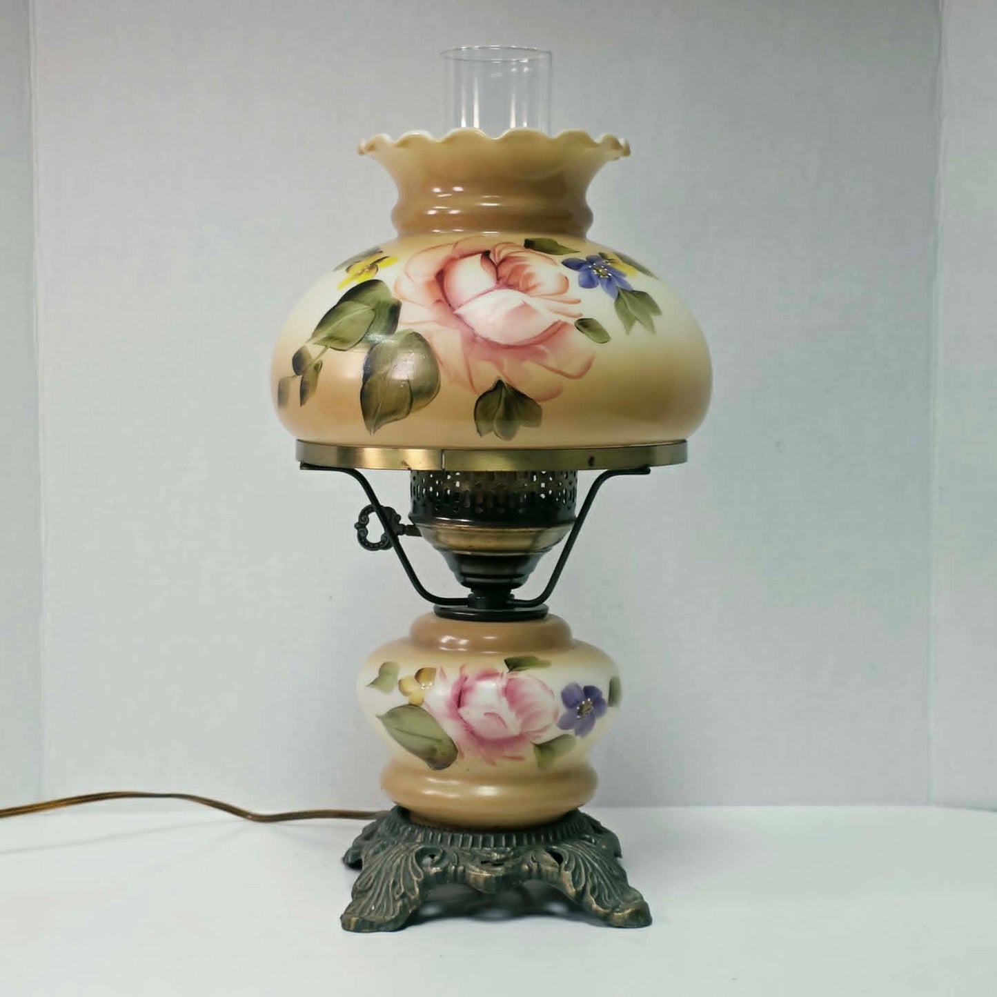 Elegant vintage hurricane lamp with floral glass design