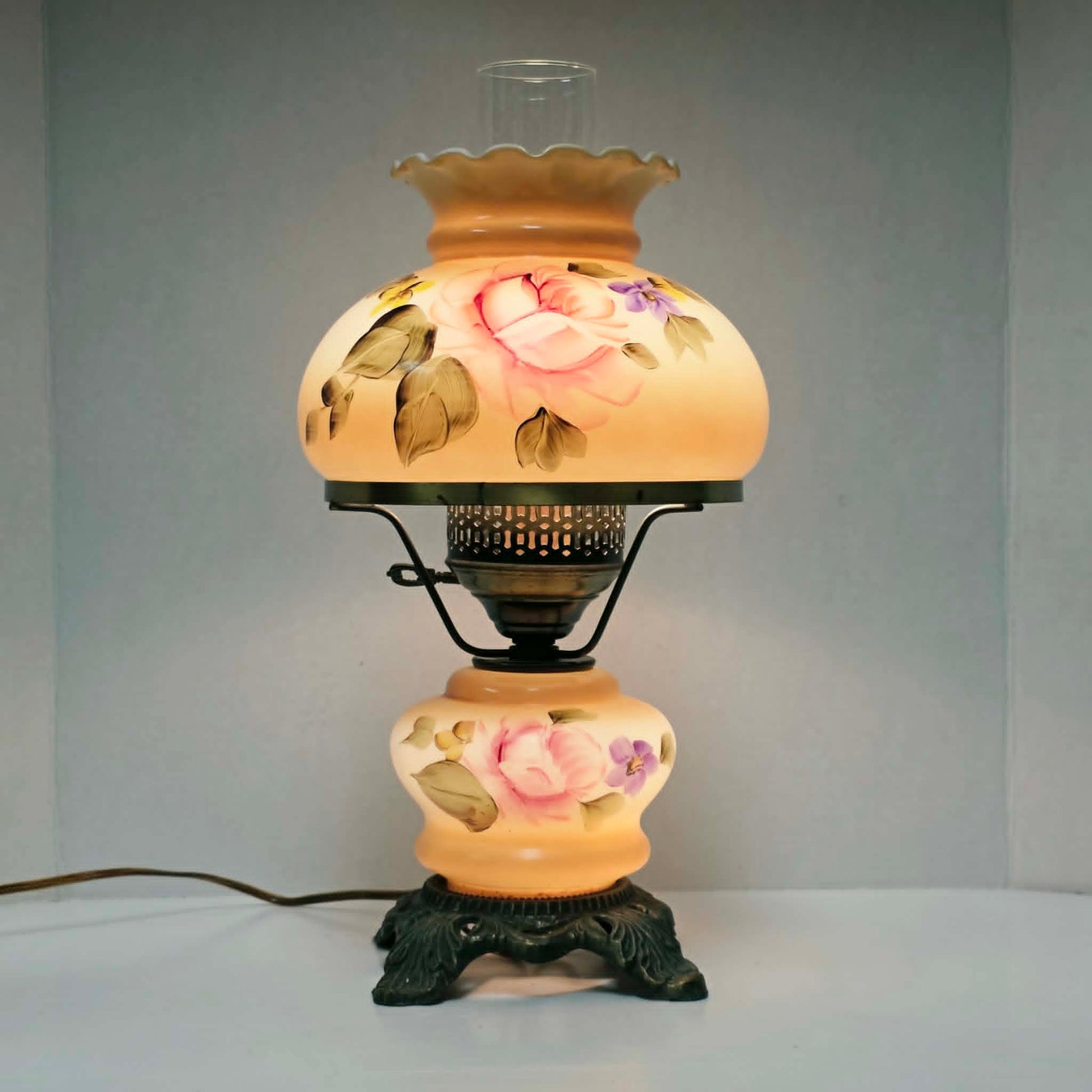 Elegant vintage hurricane lamp with floral glass design