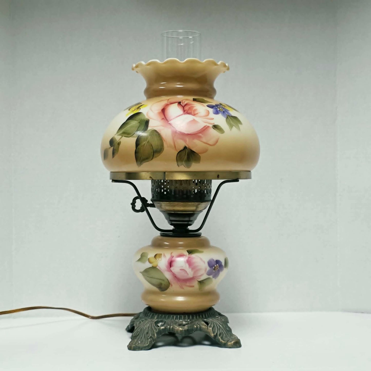 Elegant vintage hurricane lamp with floral glass design