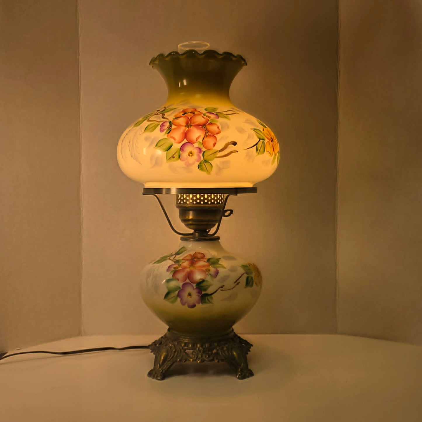 Vintage hurricane lamp with pastel hand-painted floral glass and dual lighting feature.