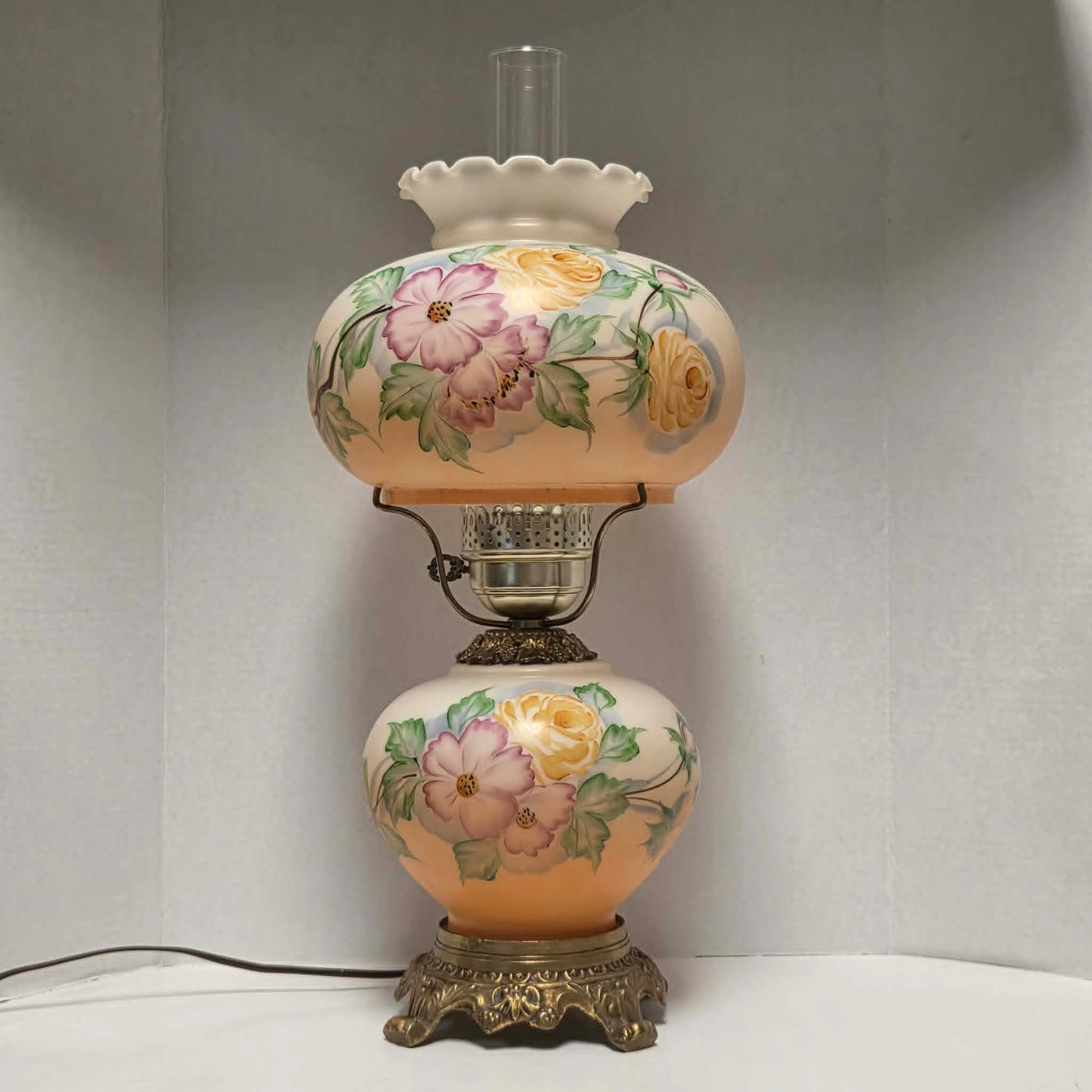 Vintage Gone with the Wind hurricane lamp with pink cosmos and yellow rose floral glass design.