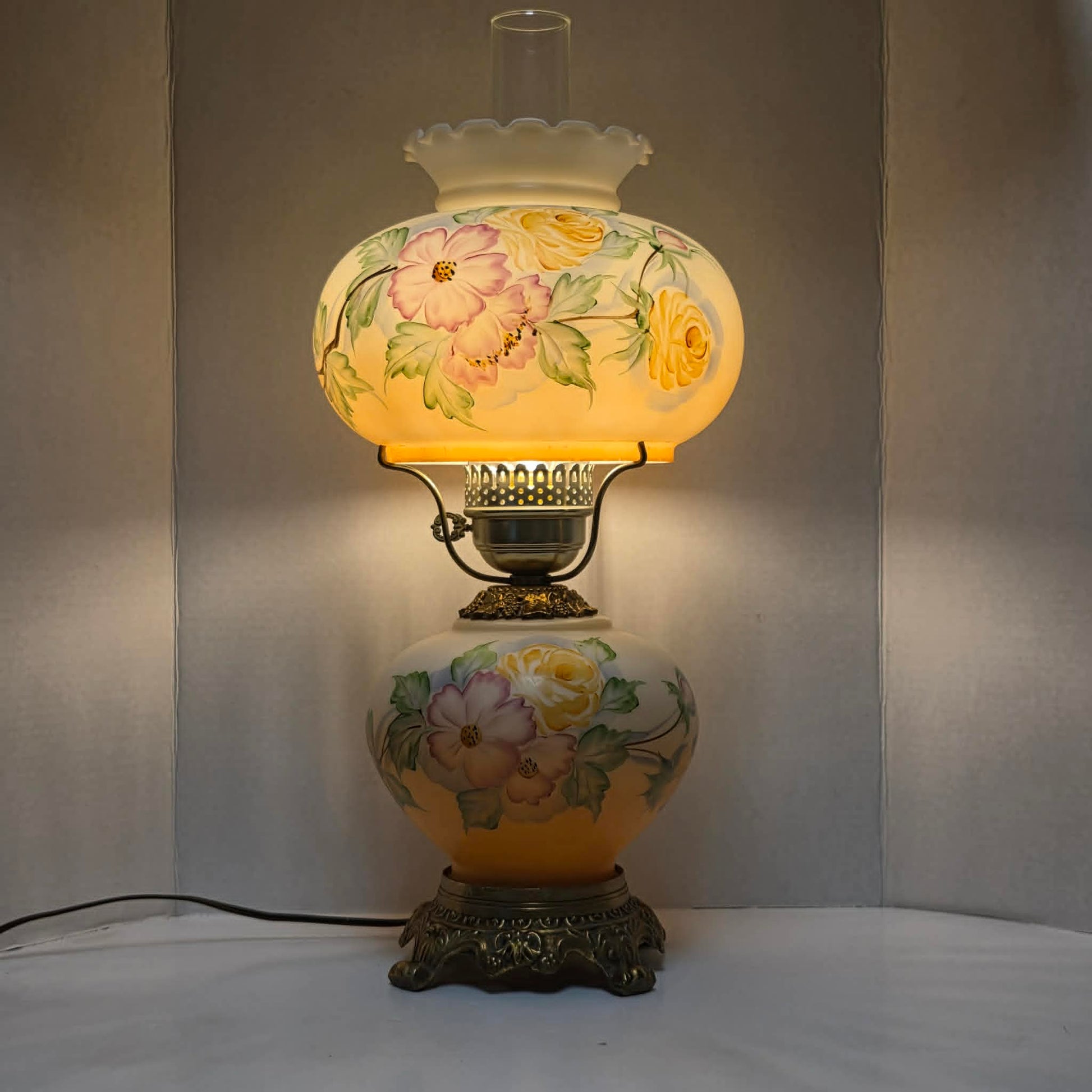 Vintage Gone with the Wind hurricane lamp with pink cosmos and yellow rose floral glass design.
