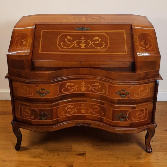 Louis XVI-style inlaid marquetry writing desk with walnut and fruitwood, featuring drop-down surface and interior drawers.