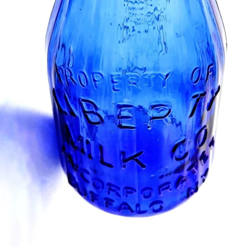 Vintage Cobalt Blue Embossed Liberty Milk Bottle