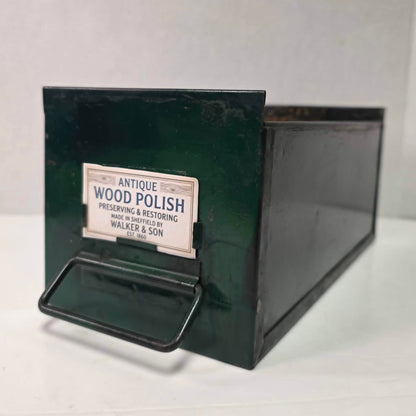 Antique industrial apothecary drawer with bail handle and label holder, vintage storage bin with aged patina.