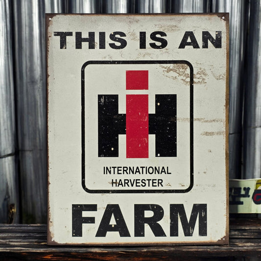 Vintage-style sign with International Harvester logo and text on a rustic background