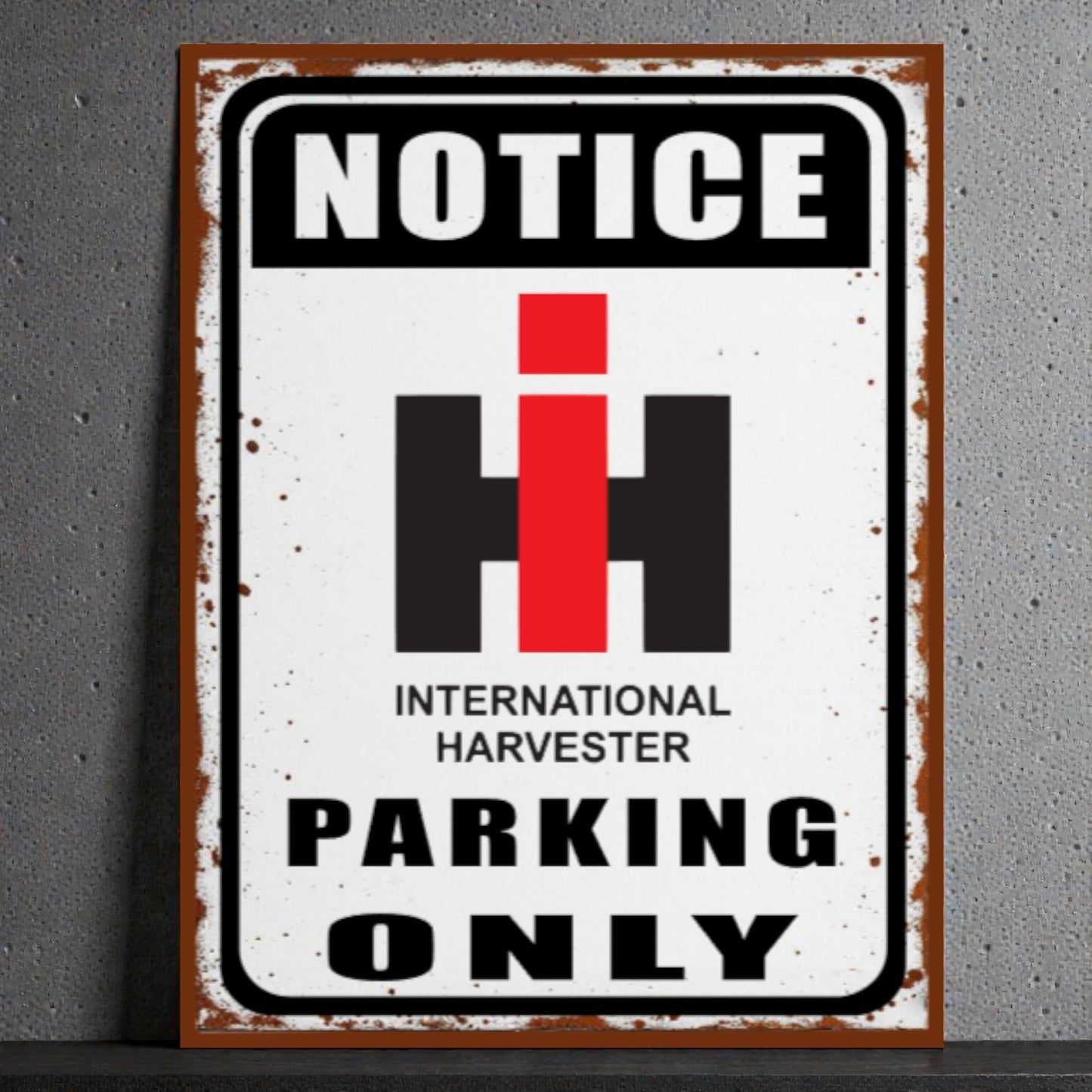 Vintage-style metal sign with 'Notice International Harvester Parking Only' text on a gray background