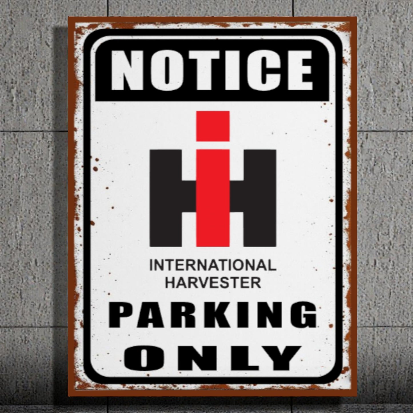 Vintage-style metal sign with 'Notice International Harvester Parking Only' text on a textured wall background.
